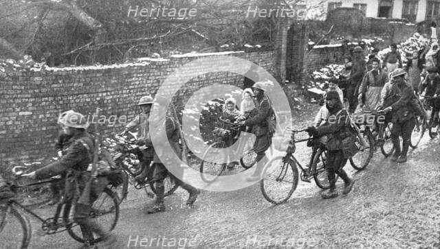 ''De la joie pour Tous; Entoures par les enfants d'un village reconquis, des cyclistes anglais ont i Creator: Unknown.