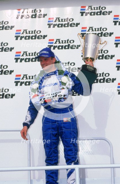 Rickard Rydell celebrates victory.British touring cars.Thruxton. Artist: Unknown.