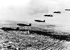 Squadron of German Heinkel He 111 bombers flying over occupied Paris, July 1940. Artist: Unknown