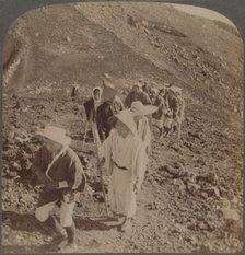 'Pilgrims, at end of weary ascent, in worship encircling crater of sacred Fujiyama, Japan', 1904. Artist: Unknown.