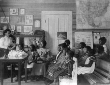 African American children and teacher in classroom studying..., Annie Davis School...Alabama, c1902. Creator: Frances Benjamin Johnston.
