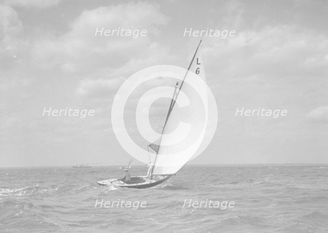 The 6 Metre class 'The Whim' (L6) sailing downwind, 1911. Creator: Kirk & Sons of Cowes.