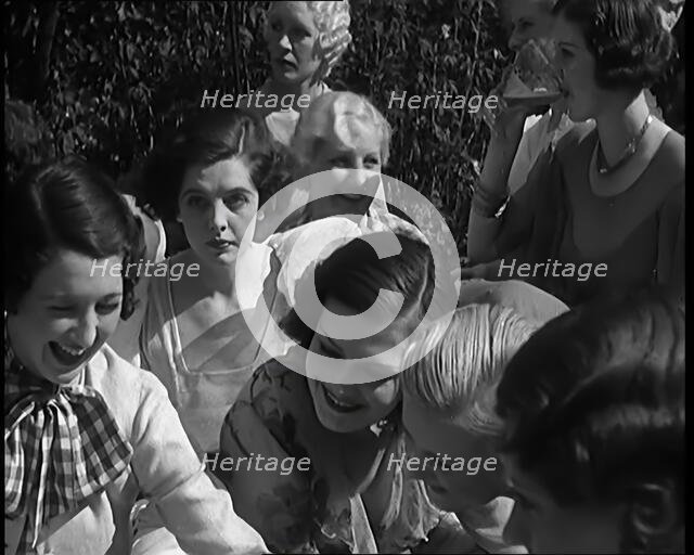 A Large Group of Female Civilians Posing for Photos, 1931. Creator: British Pathe Ltd.