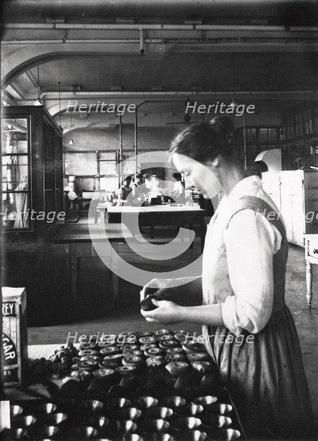 A cook makes pastry in the factory kitchens, Rowntree’s factory, York, Yorkshire, 1913. Artist: Unknown