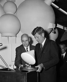 Gilruth presents President Kennedy with a model of the Apollo spacecraft, 1960s. Creator: Unknown.