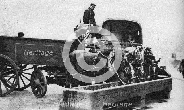 Horses drinking from a cattle trough, London, 1926-1927. Artist: Unknown