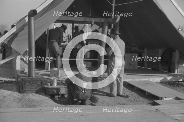 The kitchen in the camp for white flood refugees at Forrest City, Arkansas, 1937. Creator: Walker Evans.