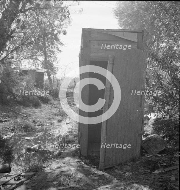 Privy in cotton camp for migratory workers, California, 1936. Creator: Dorothea Lange.