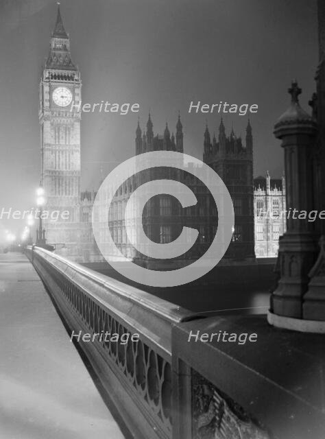 View at night along the south parapet of Westminster Bridge towards... Big Ben, early 1960s. Creator: John Gay.