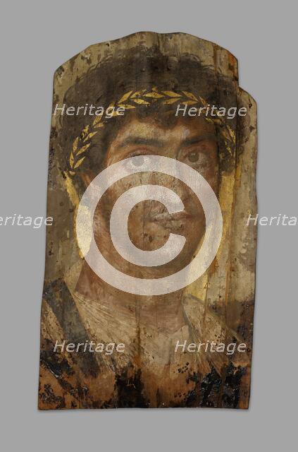 Mummy Portrait of a Man Wearing a Laurel Wreath, Fayum, Early to mid-2nd century. Creator: Unknown.
