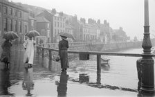 A rainy day on Pier Road, Whitby, North Yorkshire, 1896-1920. Artist: Alfred Newton & Sons.