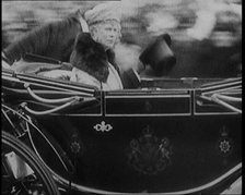 King George V and Queen Mary of Teck Returning to London in an Open Royal Coach, 1929. Creator: British Pathe Ltd.