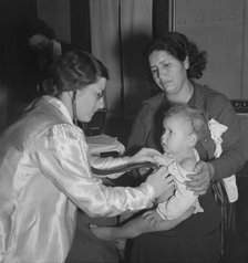 Visiting public health doctor conducts well-baby clinic..., Calipatria, Imperial Valley, 1939. Creator: Dorothea Lange.