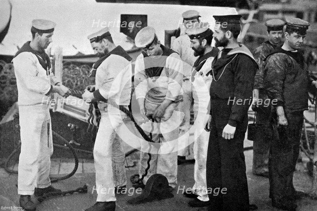 Blue jackets at work splicing a rope on board the battleship HMS 'Majestic', 1896.Artist: Gregory & Co