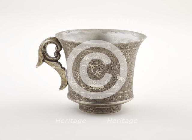 Wine cup with ring handle, birds, animals, and grape vines, Early Tang dynasty, late 7th century. Creator: Unknown.