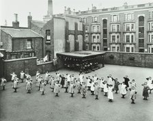 Open air exercise class, Ben Jonson School, Stepney, London, 1911. Artist: Unknown.