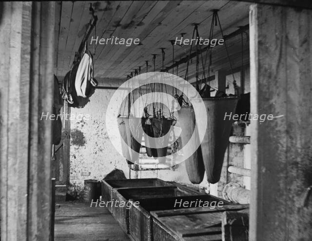 In the refining room filtering sea elephant oil, c1895. Creator: Unknown.