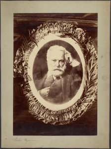 Portrait of Victor Hugo framed by wreath, about 1870-1885. Creator: Unknown.