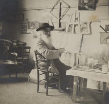 Camille Pissarro painting in his studio, c1860-1903. Creator: Unknown.