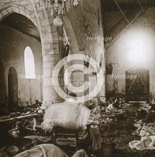 Makeshift hospital in a church, Marne, northern France, 1914. Artist: Unknown.