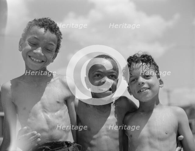 Three youngsters, Frederick Douglass housing project, Anacostia, D.C., 1942. Creator: Gordon Parks.