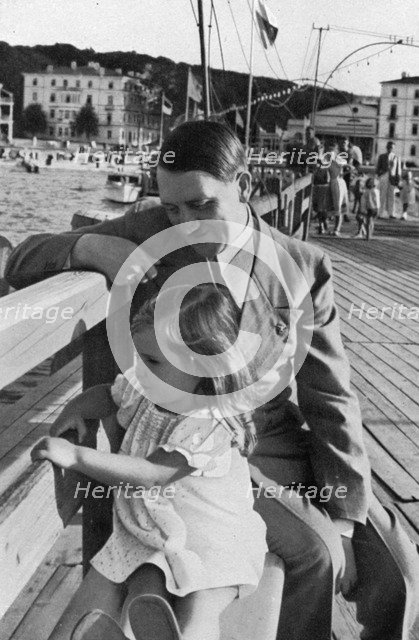 Adolf Hitler and Helga Goebbels, 1936. Artist: Unknown