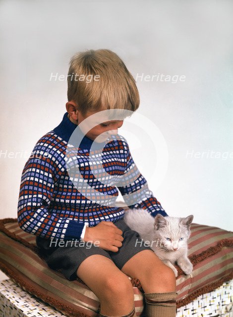Child with a cat, 1963. Artist: Michael Walters