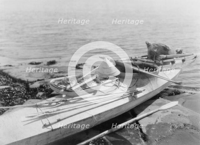 Kaiak with seal hunting equipment, Nunivak, c1929. Creator: Edward Sheriff Curtis.