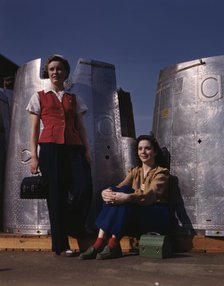 Two assembly line workers at the Long Beach, Calif., plant of Douglas Aircraft Company..., 1942. Creator: Alfred T Palmer.
