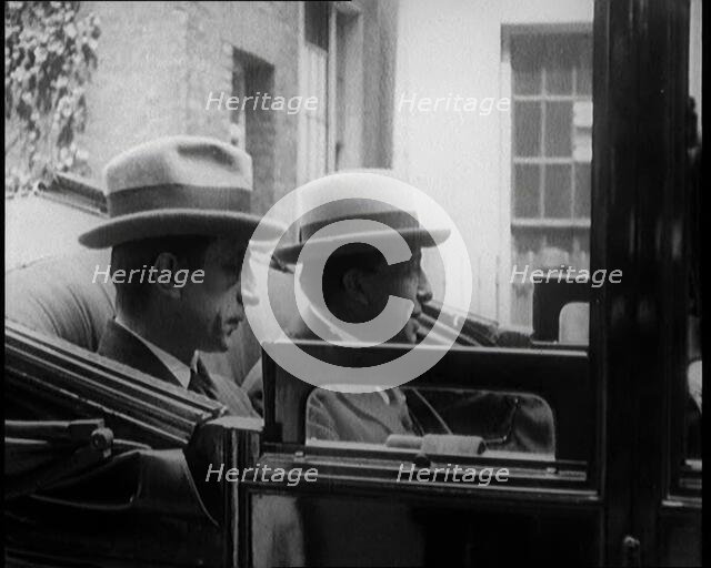 President of the Irish Republic Eamon De Valera Getting Into a Motorcar With a British Man..., 1921. Creator: British Pathe Ltd.