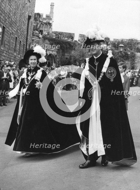 The Queen and Prince Philip walking in procession to the Queen's Free Chapel of St George, 1970. Artist: Unknown