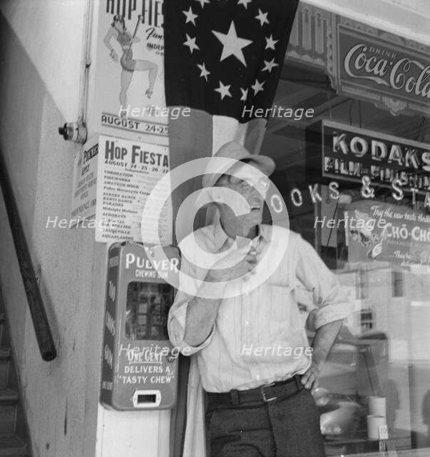On main street of Williamette Valley town, Independence, Polk County, Oregon, 1939. Creator: Dorothea Lange.