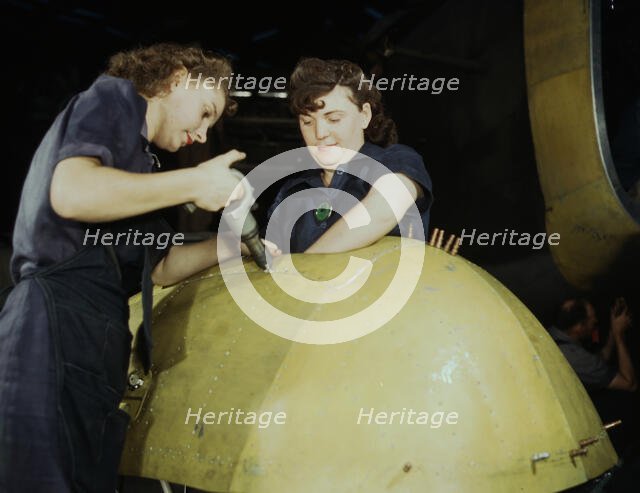 Working on a "Vengeance" dive bomber, Vultee [Aircraft Inc.], Nashville, Tennessee, 1943. Creator: Alfred T Palmer.