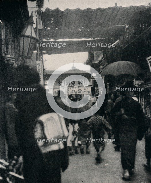 'The theatre street in Kyoto is one of the most interesting highways in the world', c1900, (1921). Artist: Julian Leonard Street.
