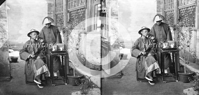 China: a Manchu man with a servant, Beijing, 1869. Creator: John Thomson.