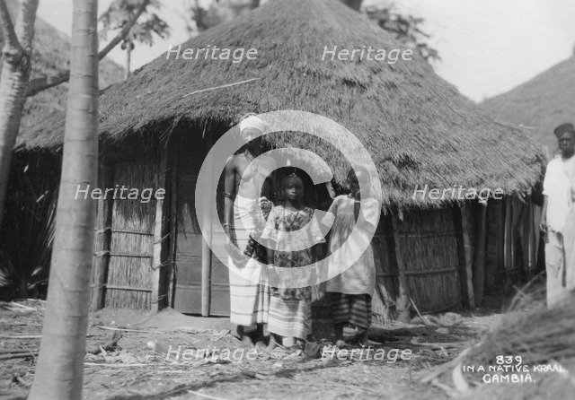 A family in front of their home, Gambia, 20th century. Artist: Unknown