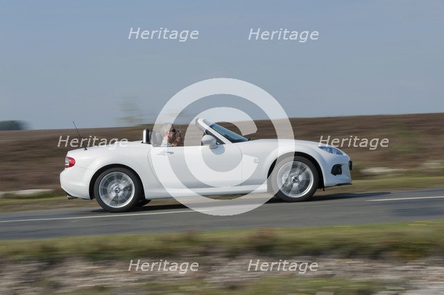 2014 Mazda MX5 Roadster Coupe Artist: Unknown.