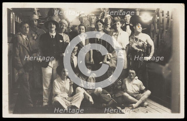 Passengers on RMS Armadale Castle, some in drag, pose for a group portrait, 1933. Creator: Unknown.