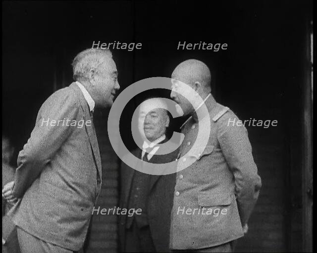 A Male Japanese Politician and a Male Military Leader Talking Together While Another Male..., 1937. Creator: British Pathe Ltd.