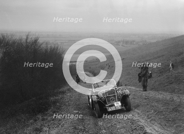 Singer 2-seater sports competing in a trial, Crowell Hill, Chinnor, Oxfordshire, 1930s. Artist: Bill Brunell.