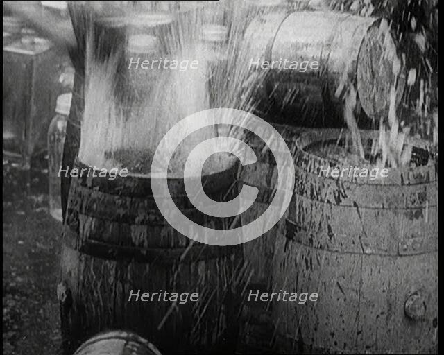 Prohibition Scenes in the United States of America. Barrels of Alcoholic Beverages Being..., 1920. Creator: British Pathe Ltd.