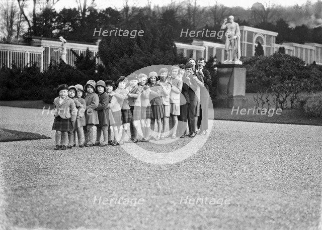 Cavendish family group of 16 grandchildren in the gardens of Chatsworth, Derbyshire, 1930. Artist: JR Board