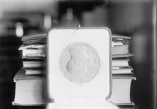 Nobel Peace Prize - The Medal, 1913. Creator: Harris & Ewing.