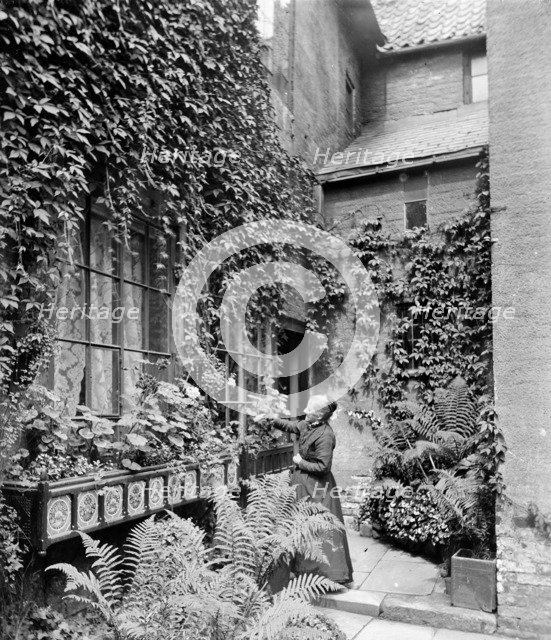 A lady gardener, c1860-c1922. Artist: Henry Taunt