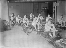 Columbia crew team in mock shells practicing in club house, 1910. Creator: Bain News Service.