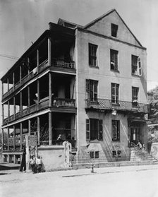 Front and side view of apartment(?) house, 61 Washington Street, Charleston, South..., c1933 - 1940. Creator: Frances Benjamin Johnston.