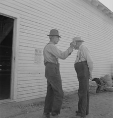 Oregon farmers, old settlers, at farmer's public sale, Saturday, Nyssa, Malheur County, Oregon, 1939 Creator: Dorothea Lange.