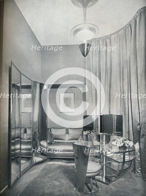 'Part of a boudoir dressing-room in dove grey satin and chromium plated metal, by Eugene Printz of P Artist: Unknown.