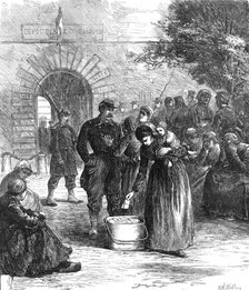 Outside the prison of La Roquette, Paris: letters for the prisoners, 1871. Creator: William Simpson.