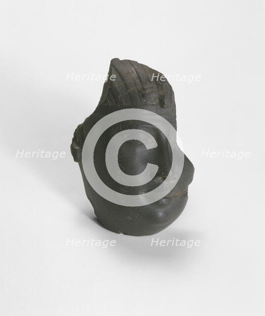 Fragment of a Head from a Statue of a King, Egypt, Late Period, Dynasty 30 (380-343 BCE). Creator: Unknown.